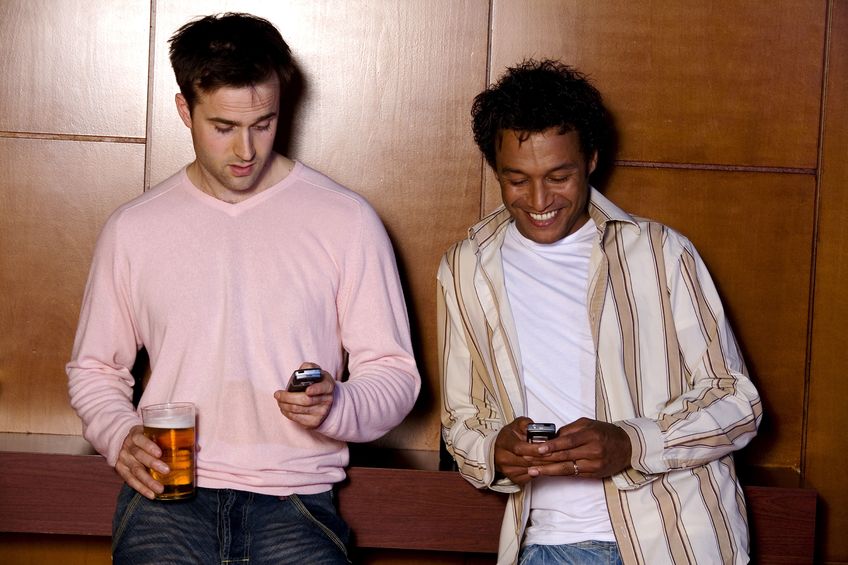 two men with mobile phones